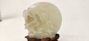 An antique Chinese jade ornament carved with blossom tree, on carved timber stand, Qing Dynasty, 18th/19th century, 8cm high overall - 15