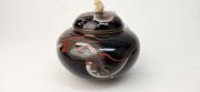 An antique Japanese cloisonne lidded pot decorated with dragon motif on black ground, with later carved ivory finial, Meiji Period, ​​​​​​​10cm high - 10