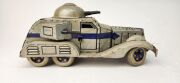 Two vintage Japanese clockwork tinplate armoured cars by T.N. TOYS, 20th century, 23cm long - 3