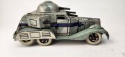 Two vintage Japanese clockwork tinplate armoured cars by T.N. TOYS, 20th century, 23cm long - 13