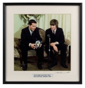 THE BEATLES IN AUSTRALIA, 1964: "Ernie Signley interviews John about his book, Adelaide 1964". Original colour print, signed by Vic Grimmett in the lower margin, 24.5 x 24.5cm, 35 x 34cm overall.
