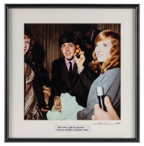 THE BEATLES IN AUSTRALIA, 1964: "Paul with a gift he received from an admirer, Adelaide 1964". Original colour print, signed by Vic Grimmett in the lower margin, 24.5 x 24.5cm, 35 x 34cm overall.