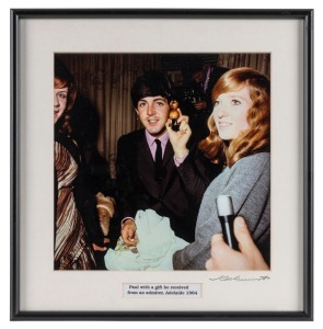 THE BEATLES IN AUSTRALIA, 1964: "Paul with a gift he received from an admirer, Adelaide 1964". Original colour print, signed by Vic Grimmett in the lower margin,  24.5 x 24.5cm, 35 x 34cm overall. 