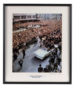 THE BEATLES IN AUSTRALIA, 1964: "Beatles Arrival, Adelaide Town Hall". Original colour print, signed by Vic Grimmett in the lower margin,  29.5 x 24.5cm, 40 x 34cm overall. 