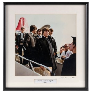 "Beatles Adelaide Airport 1964". Original colour print, signed by Vic Grimmett in the lower margin,  24.5 x 24.5cm, 35 x 34cm overall. 