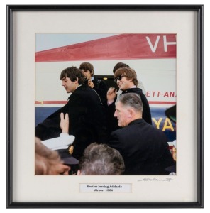 THE BEATLES IN AUSTRALIA, 1964: "Beatles leaving Adelaide Airport 1964". Original colour print, signed by Vic Grimmett in the lower margin,  24 x 24.5cm, 35 x 34cm overall. 