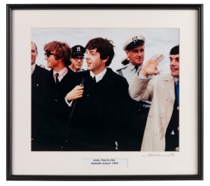 THE BEATLES IN AUSTRALIA, 1964: "John, Paul & Jim, Adelaide airport 1964". Original colour print, signed by Vic Grimmett in the lower margin,  24.5 x 29.5cm, 35 x 39cm overall. 