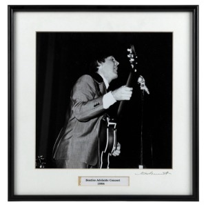 THE BEATLES IN AUSTRALIA, 1964: "Beatles Adelaide Concert,1964". Original black and white print, signed by Vic Grimmett in the lower margin, 24.5 x 24.5cm, 35 x 34cm overall.