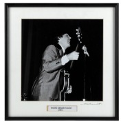 THE BEATLES IN AUSTRALIA, 1964: "Beatles Adelaide Concert,1964". Original black and white print, signed by Vic Grimmett in the lower margin, 24.5 x 24.5cm, 35 x 34cm overall.
