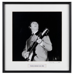 THE BEATLES IN AUSTRALIA, 1964: "Beatles Adelaide visit, 1964". Original black and white print, signed by Vic Grimmett in the lower margin,  24.5 x 24.5cm, 35 x 34cm overall. 