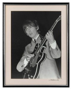 THE BEATLES IN AUSTRALIA, 1964: "George Harrison". Original black and white print, signed by Vic Grimmett in the lower margin, Number 1 of a limited printing of 20. 39.5 x 29.5cm, 49.5 x 39.5cm overall.