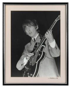 THE BEATLES IN AUSTRALIA, 1964: "George Harrison". Original black and white print, signed by Vic Grimmett in the lower margin,  Number 1 of a limited printing of 20. 39.5 x 29.5cm, 49.5 x 39.5cm overall. 