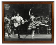 RUDOLF NUREYEV performs in Don Quixote with the Australian Ballet. Original black and white print, 1970, Signed by Rudolf Nureyev and Vic Grimmett. 45 x 55cm overall.