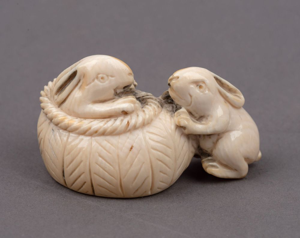 Three Japanese carved ivory netsukes comprising: turtle, rats and ...