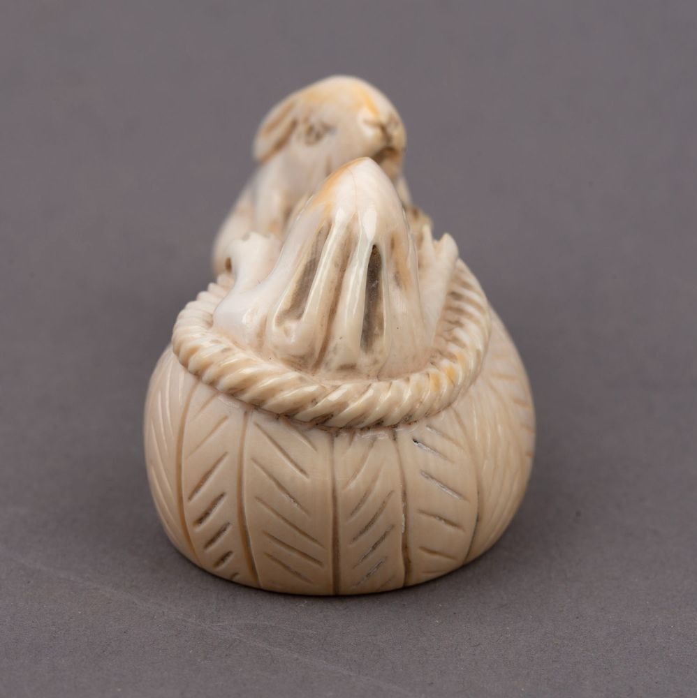 Three Japanese carved ivory netsukes comprising: turtle, rats and ...