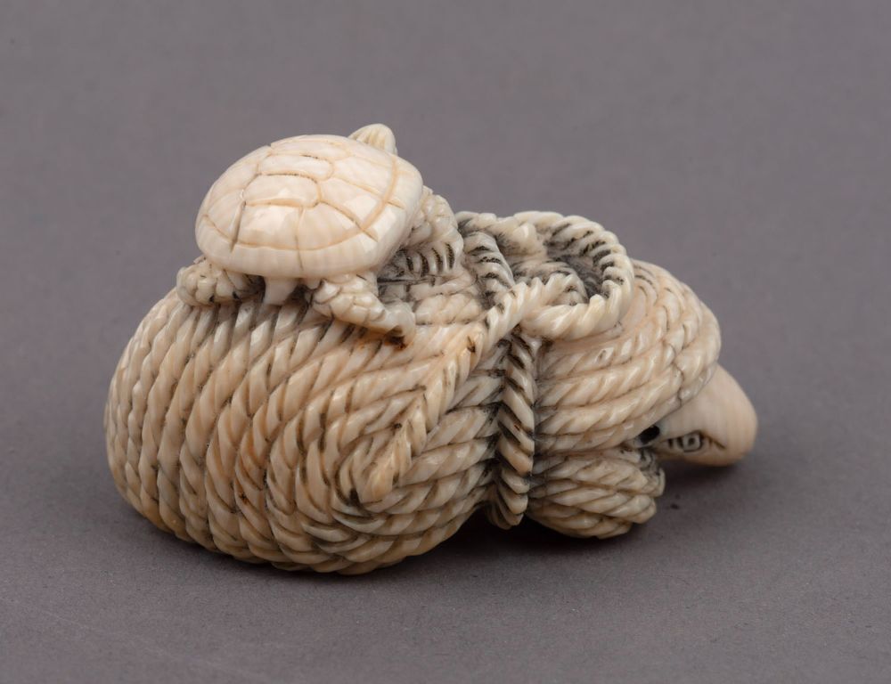 Three Japanese carved ivory netsukes comprising: turtle, rats and ...