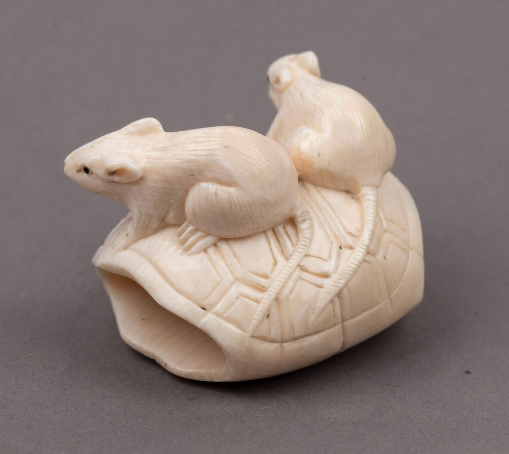 Three Japanese carved ivory netsukes comprising: turtle, rats and ...