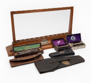 WILLIAM JOHN BAKER (c. 1857-1930) point of sale oak cutlery stand, emblazoned with Baker's patriotic emu and kangaroo silver finished plaque, together with a handsome assortment of Baker's products including a boxed two day razor set, implement holster, razors, implements and scissor set, 19th/20th century, (7 items), the cutlery stand 26cm high, 50cm wide