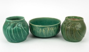 MELROSE WARE green glazed pottery fruit bowl with gum leaf decoration, together with two green glazed pottery vases decorated with large gumnuts and leaves, (3 items), the vases both stamped "Melrose Ware, Australian", the bowl 8cm high, 19cm wide