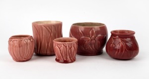 MELROSE WARE five assorted burgundy glazed pottery vases decorated with gumnuts, leaves and rare orchid example, the largest 11cm high