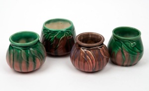 MELROSE WARE group of four assorted pottery vases decorated with gumnuts and leaves, all glazed in two tone colourways, stamped "Melrose Ware, Australian", the largest 8cm high