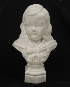 A terracotta pottery bust of a boy with white painted finish, incised on reverse "HARVEY, Melbourne, 1894", 17cm high