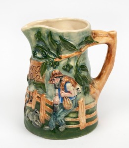 WALTZING MATILDA pottery jug with musical movement, 19.5cm high