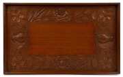 PETER HARLEY (attributed) Queensland silky oak serving tray carved with kookaburras and roses, early 20th century, 58cm wide