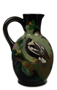 GOUDA Dutch pottery "Magpie" hand-painted jug with floral decoration, signed "799, HOLLAND, GOUDA, MAGPIE, DUTCH-ART-POTTERY" with pictorial mark, 18.5cm high