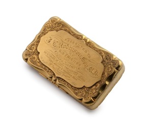 An important Australian solid yellow high carat gold snuff box, the lid with floral and foliate decoration surrounding a raised cartouche with engraved presentation inscription, the base with chased & engraved scene of an Aboriginal man with spear hunting an emu, and two parrots or cockatoos flying by at right, the scene with patinated background and surrounding neo-rococo scrolled foliate decoration. finely engraved with foliate design and Aboriginal figure hunting an emu, 7cm wide, 93.4grams,