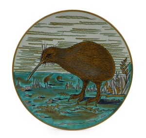 GOUDA hand-painted Dutch pottery "Kiwi" plaque, circa 1910, signed "KIWI, HOLLAND, GOUDA, GIBSON'S & PATERSON, LTD., N.Z." with pictorial mark, 27cm diameter