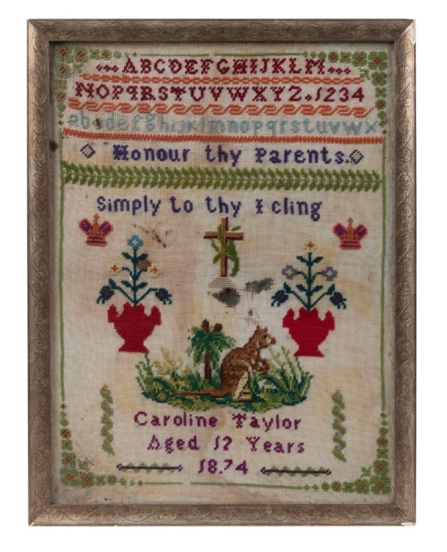 Rare antique Australian sampler by "CAROLINE TAYLOR, AGED 12 YEARS, 1874", depicting a kangaroo in landscape, crowns and cross, housed in later gilt frame. 44 x 34cm overall