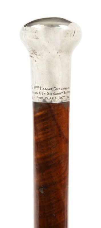 An antique walking stick with sterling silver top engraved "To Mrs HAMAR GREENWOOD FROM GEN. SIR HARRY BARRON. GOV. W. Aus. Oct. 1913" on fiddleback blackwood shaft with horn ferrule, 102cm high