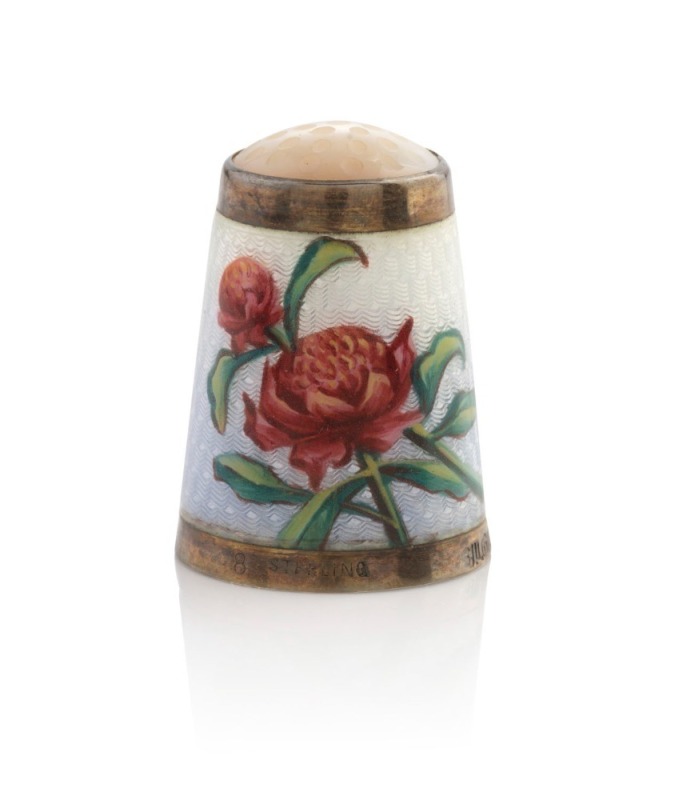 A rare Australian silver thimble with waratah enamel decoration and mother of pearl top, stamped "Sterling" and housed in original Flavelle Brothers scarlet leather plush fitted box, 19th century, 2.7cm high