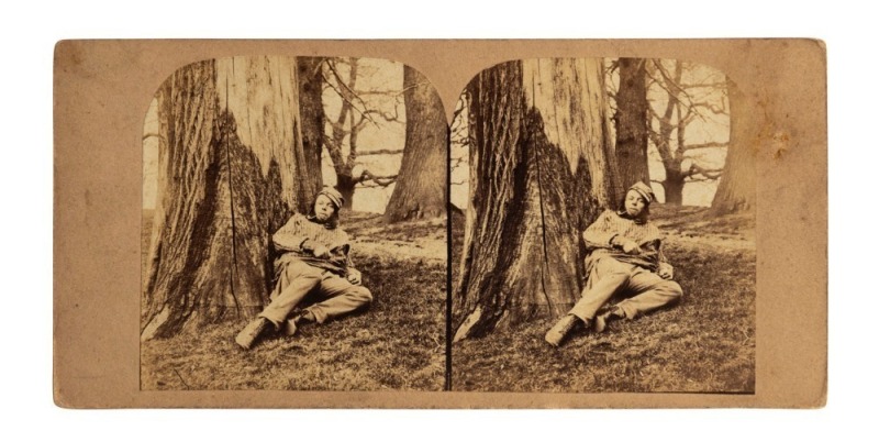 [GOLD MINING]. Stereoview card, circa 1860s, by an unknown photographer, two arched albumen paper prints, each 74 x 67mm laid down on a card, overall 85 x 175mm; with printed label verso "125. Australia. Resting on his Road to the Diggings". An apparently