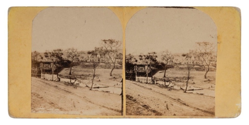 [GEELONG INTEREST]. Two very early stereoview cards depicting FYAN'S FORD BRIDGE over the Barwon River; one bears a printed label verso "FYAN'S FORD, GEELONG" on a yellow-front card with images approximately 83 x 68mm and has been dated to 1852; the other