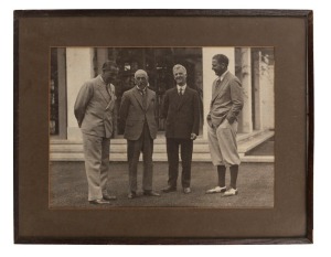 JOE KIRKWOOD (Australia’s First International Golfer), standing with admirers, former Australian Prime Minister BILLY HUGHES and the then current Prime Minister JOSEPH SCULLIN, as well as WALTER HAGEN. Silver gelatin photograph taken on the 1st of April, 1930. Housed in original wooden frame with brown card mount, 25 x 35cm, 37 x 37cm overall