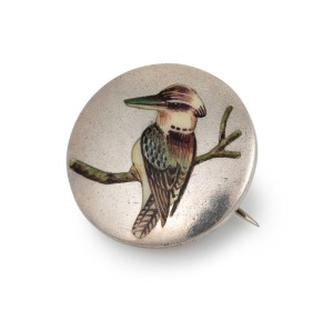 An antique sterling silver circular brooch with enamel kookaburra decoration, made in Birmingham, circa 1908, 2.3cm diameter