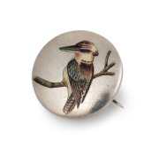 An antique sterling silver circular brooch with enamel kookaburra decoration, made in Birmingham, circa 1908, ​​​​​​​2.3cm diameter