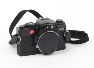 LEITZ: Leica R4s SLR camera body [#636269], c. 1983, with body cap and neck strap.