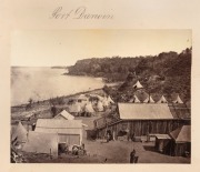 [NORTHERN TERRITORY] Port Darwin, photograph, circa 1880s, 15.5 x 21cm laid down on album page backed with two additional photographs, "Fitzroy River" (12 x 18cm) and "Rockhampton - Main Street" (10 x 15cm), all annotated in a neat hand. (3). - 2