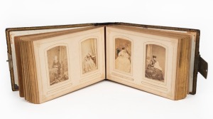THE BELL FAMILY OF HOBART and COLAC: A black gilded leather-bound Bell family photograph album (16.5 x 23.2 x 6.0cm) with brass clasp, 54pp. partially filled with 36 albumen paper cartes-de-visite taken in Melbourne, Hobart & the U.K., c.1860s-1870s; the last photograph in the album is of George Meredith Bell’s grave, c.1890s, and is the only New Zealand photograph.