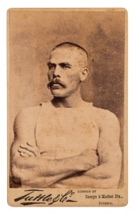 TUTTLE & CO., SYDNEY: An original carte-de-visite, circa 1880s, with an albumen paper photograph of the Australian professional rower, WILLIAM "BILL" BEACH, World Sculling Champion 1884-87; the back of the card devoted to an advertisement for the "New York Tailoring Company of George Street, Haymarket."
