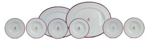 ALLPORT FAMILY, TASMANIA. Two antique English meat platters and six matching bowls with burgundy and gilt border and emblazoned with Allport family crest and motto “L’AMOR ET L’ESPERANCE”, circa 1870s, stamped “Wm. FAIRBAIRNS”, the platter 53.5m wide. (8 items),