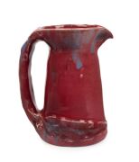 PHILIPPA JAMES pink and mauve glazed pottery jug with applied gum blossom, leaf and branch handle, incised "Philippa James", 16.5cm high