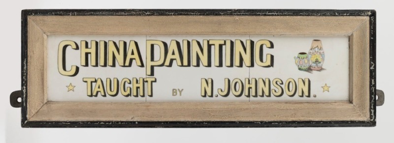 "CHINA PAINTING TAUGHT BY N. JOHNSON" hand-painted wall sign on white ceramic tiles in original hand-painted frame, early 20th century, 17 x 52cm overall