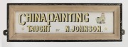 "CHINA PAINTING TAUGHT BY N. JOHNSON" hand-painted wall sign on white ceramic tiles in original hand-painted frame, early 20th century, 17 x 52cm overall