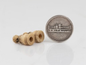 MELBOURNE INTERNATIONAL EXHIBITION 1888 stanhope in whalebone miniature field glasses, together with a SYDNEY INTERNATIONAL EXHIBITION "GARDEN PALACE" 1879/1880 silver token mounted as a button, (2 items)
