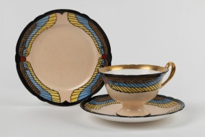 MAIDA WRIGHT hand-painted porcelain cup, saucer and plate set in the Egyptian Revival style, (3 items), signed "Maida Wright", the saucer 15cm diameter