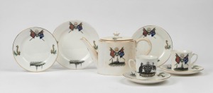 "H.M.A.S. SYDNEY DESTROYED THE EMDEN AT KEELING COCOS ISLAND, NOV. 9, 1914" antique English commemorative porcelain teapot, together with a pair of matching teacups, saucers and plates. Reverse adorned with coat of arms and emblazoned "Advance Australia, Commonwealth of Australia", (7 items), green factory mark to bases "Radfords, Crown China, England", the teapot 13cm high, 25cm wide